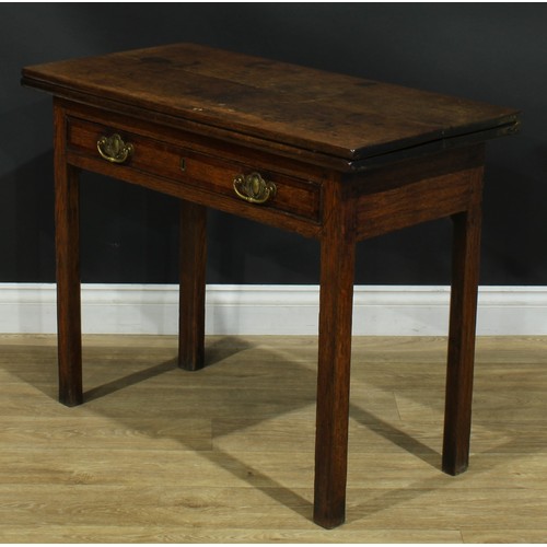 1170 - A George III oak tea table, hinged rectangular top above a long mahogany crossbanded drawer, interna... 