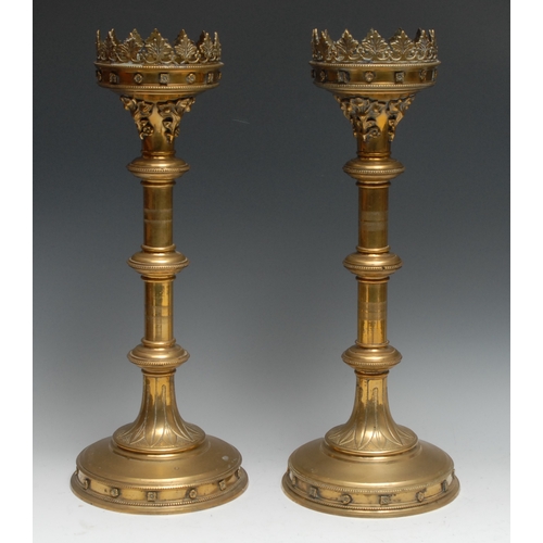 1190 - A pair of large Gothic Revival brass pricket altar candlesticks, in the manner of A W N Pugin, folia... 