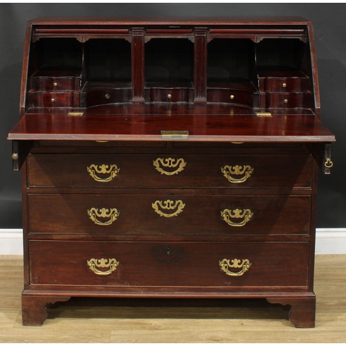 1106 - A George III mahogany bureau, fall front enclosing small drawers, pigeonholes and secret compartment... 