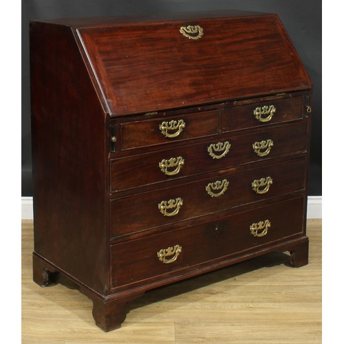 1106 - A George III mahogany bureau, fall front enclosing small drawers, pigeonholes and secret compartment... 