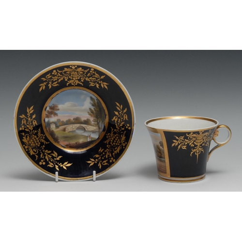 411 - A large Chamberlain’s Worcester Named View  breakfast  cup and stand,  painted with Cranford Bridge ... 