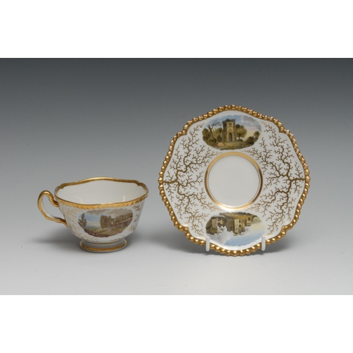 409 - A Flight,  Barr and Barr Named View teacup and saucer, painted with  Brougham Castle, Westmoorland a... 