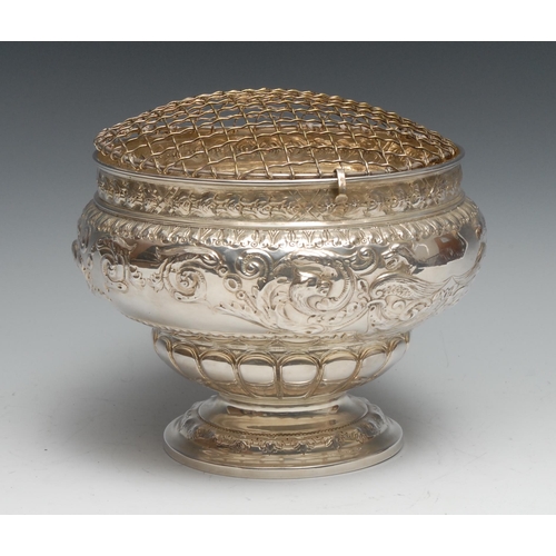 236 - A Victorian silver ogee pedestal rose bowl, chased with fanciful beasts, flowers and scrolling folia... 