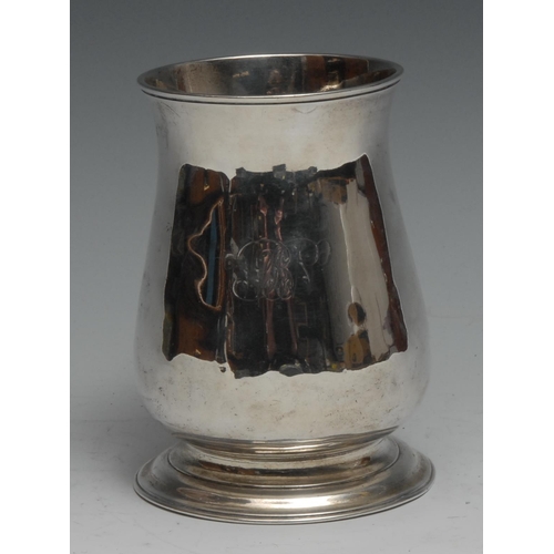 102 - A George II silver bell shaped mug, scroll-capped handle, skirted base, 12cm high, London 1748, 306g