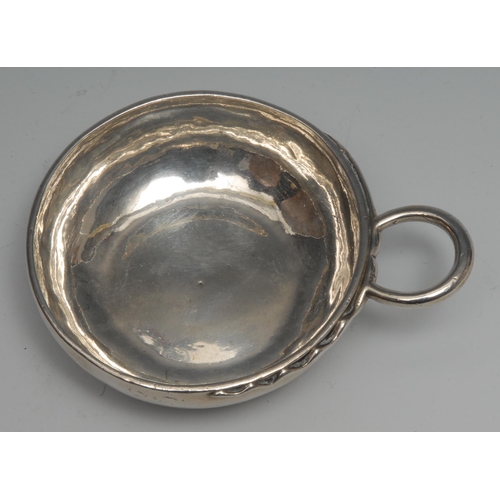 78 - A 19th century French silver wine taster, quite plain, serpent loop handle, 9cm diam, 100g