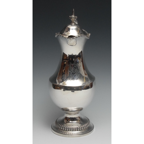 267 - An early George III silver pedestal wine jug, hinged domed cover with pointed leafy knop finial, aca... 