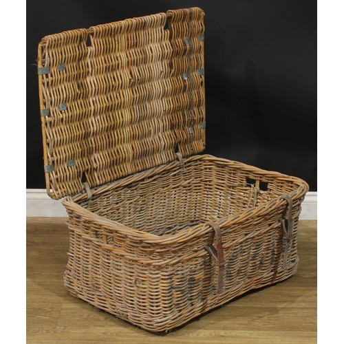 1054 - A country house wicker linen basket, hinged top, leather straps, 38.5cm high, 80cm wide, 56cm deep