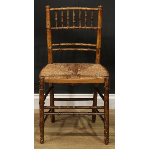 1129 - A set of three 19th century faux-bamboo side chairs, rush seats, 84.5cm high, 45cm wide, the seat 34... 