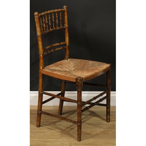 1129 - A set of three 19th century faux-bamboo side chairs, rush seats, 84.5cm high, 45cm wide, the seat 34... 