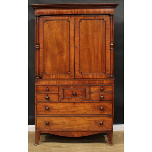 1415 - A Post-Regency mahogany hanging press cupboard, formerly a linen press, possibly Scottish, outswept ... 