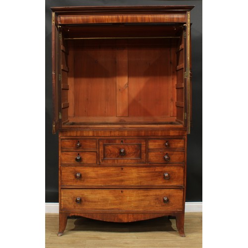 1415 - A Post-Regency mahogany hanging press cupboard, formerly a linen press, possibly Scottish, outswept ... 