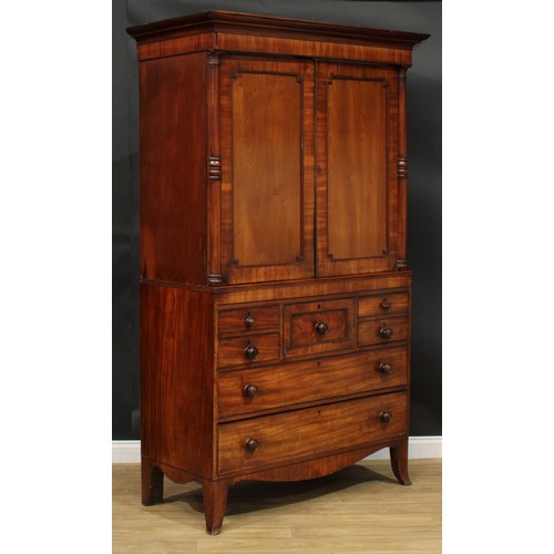 1415 - A Post-Regency mahogany hanging press cupboard, formerly a linen press, possibly Scottish, outswept ... 