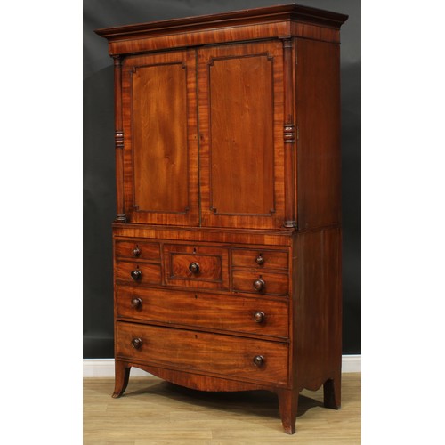 1415 - A Post-Regency mahogany hanging press cupboard, formerly a linen press, possibly Scottish, outswept ... 