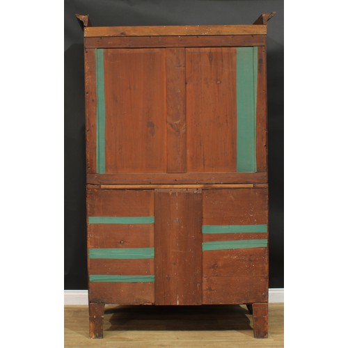 1415 - A Post-Regency mahogany hanging press cupboard, formerly a linen press, possibly Scottish, outswept ... 