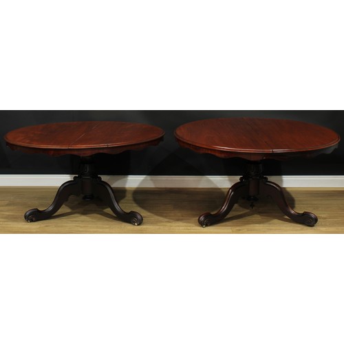 1408 - A pair of Victorian mahogany centre tables, each with a circular tilting top with moulded edge and w... 