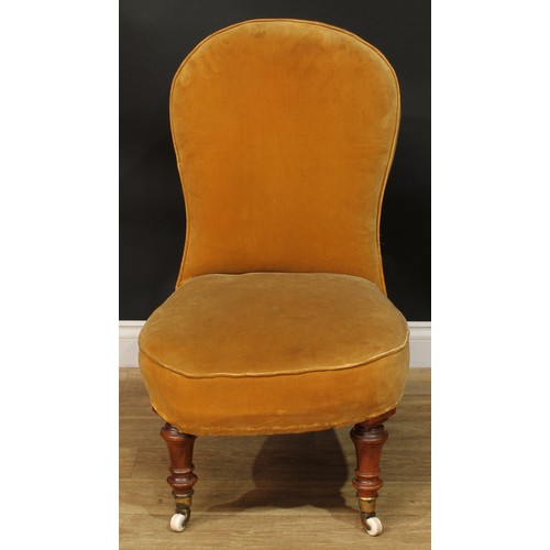 1467 - A Victorian drawing room chair, stuffed-over upholstery, turned forelegs, ceramic casters, 92.5cm hi... 