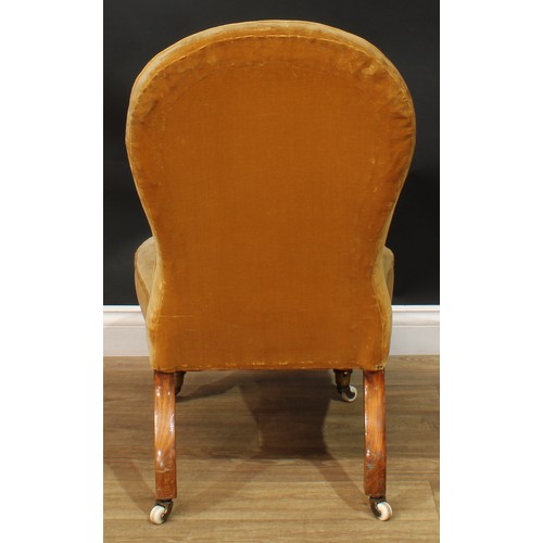 1467 - A Victorian drawing room chair, stuffed-over upholstery, turned forelegs, ceramic casters, 92.5cm hi... 