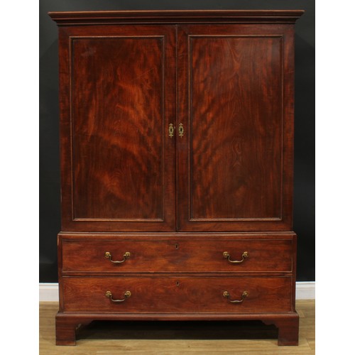 1219 - A George III mahogany hanging press cupboard, formerly a linen press, moulded cornice above a pair o... 