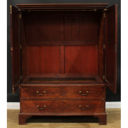 1219 - A George III mahogany hanging press cupboard, formerly a linen press, moulded cornice above a pair o... 