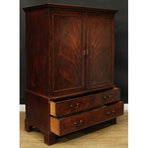 1219 - A George III mahogany hanging press cupboard, formerly a linen press, moulded cornice above a pair o... 