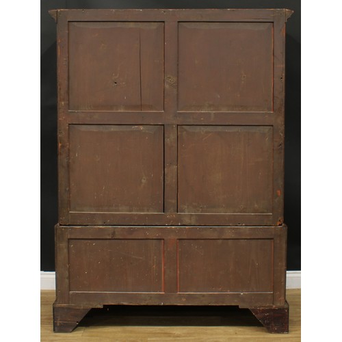 1219 - A George III mahogany hanging press cupboard, formerly a linen press, moulded cornice above a pair o... 