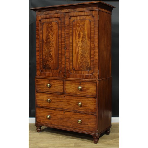 1273 - A George IV mahogany hanging press cupboard, formerly a linen press, moulded cornice above a pair of... 