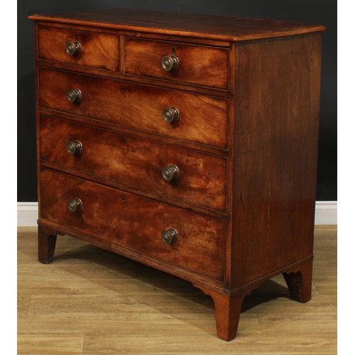 1108 - A George III mahogany chest, of two short and three long graduated cockbeaded drawers, bracket feet,... 