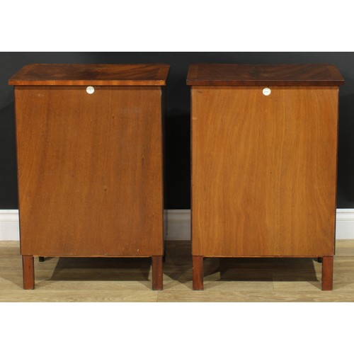 1395 - A pair of George III style inverted bowfront bedside cabinets, each with a slightly oversailing top ... 