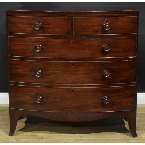 1184 - A George IV mahogany bowfront chest, slightly oversailing top above two short and three long graduat... 