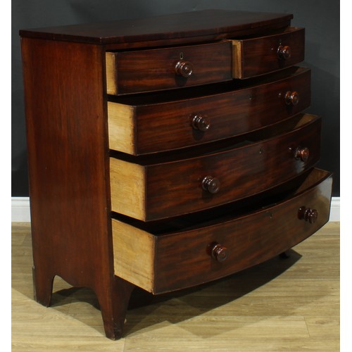 1184 - A George IV mahogany bowfront chest, slightly oversailing top above two short and three long graduat... 