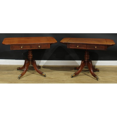 1405 - A pair of Regency mahogany sofa tables, each with a rounded rectangular top with fall leaves above a... 