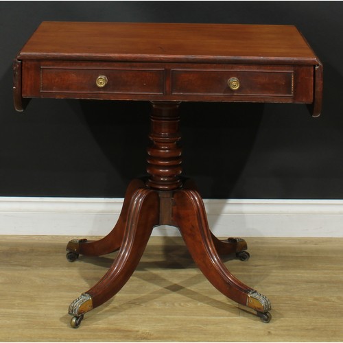 1405 - A pair of Regency mahogany sofa tables, each with a rounded rectangular top with fall leaves above a... 