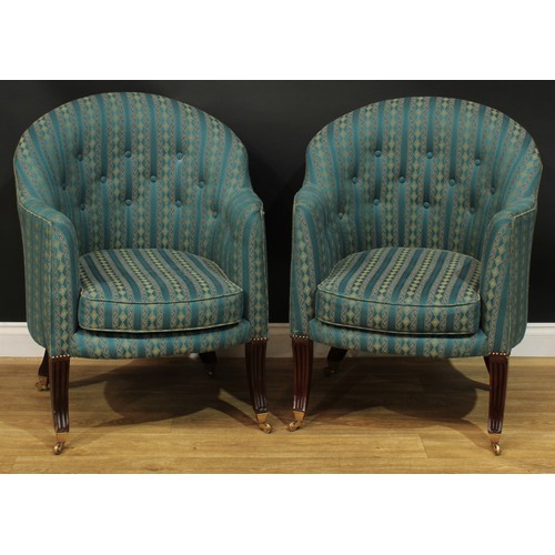 1406 - A pair of Regency style club elbow chairs, stuffed-over upholstery, squab cushions, sabre forelegs, ... 