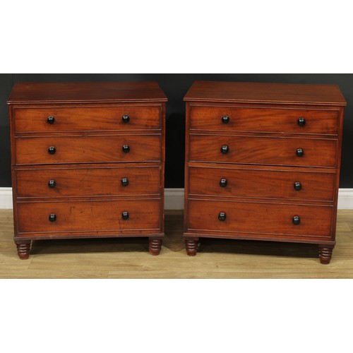 1364 - A near pair of 19th century mahogany commodes, each as a chest of four long drawers, turned feet, 75... 