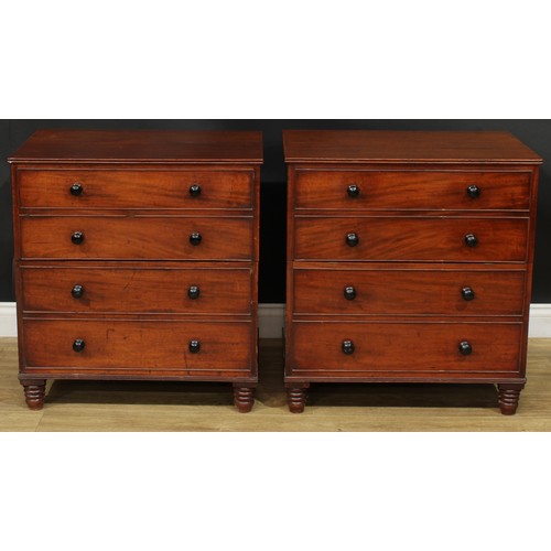 1364 - A near pair of 19th century mahogany commodes, each as a chest of four long drawers, turned feet, 75... 