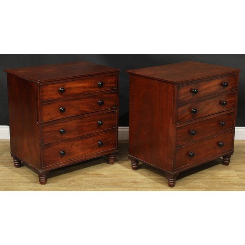 1364 - A near pair of 19th century mahogany commodes, each as a chest of four long drawers, turned feet, 75... 