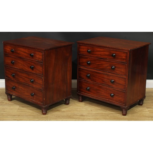 1364 - A near pair of 19th century mahogany commodes, each as a chest of four long drawers, turned feet, 75... 