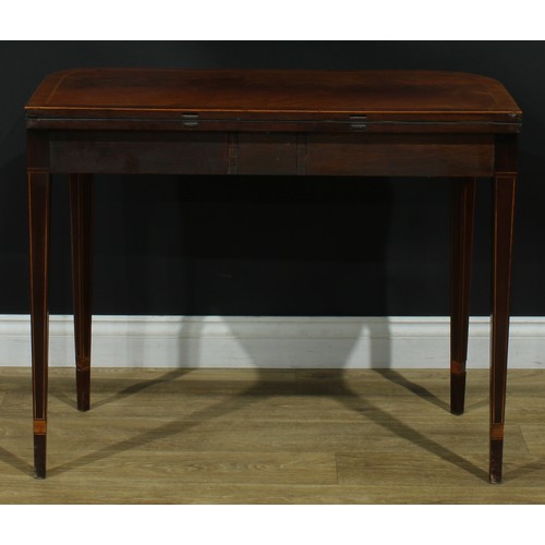 1394 - A pair of George III mahogany D-shaped card tables, each with a hinged crossbanded top enclosing a b... 