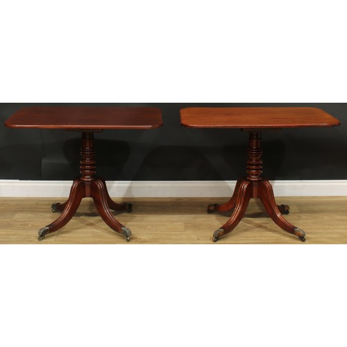 1404 - A pair of Regency mahogany occasional tables, each with a rounded rectangular top, turned column, sa... 