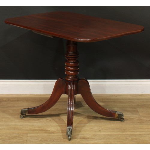 1404 - A pair of Regency mahogany occasional tables, each with a rounded rectangular top, turned column, sa... 