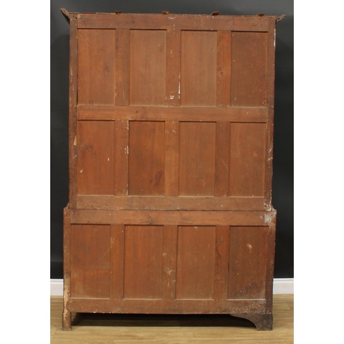 1269 - A George III oak housekeeper’s livery or provision cupboard, moulded cornice above a pair of panel d... 