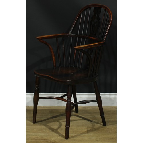 1122 - A set of four 19th century Windsor elbow chairs, each with a low hoop back, shaped and pierced splat... 