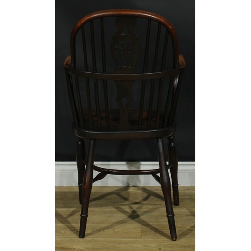 1122 - A set of four 19th century Windsor elbow chairs, each with a low hoop back, shaped and pierced splat... 