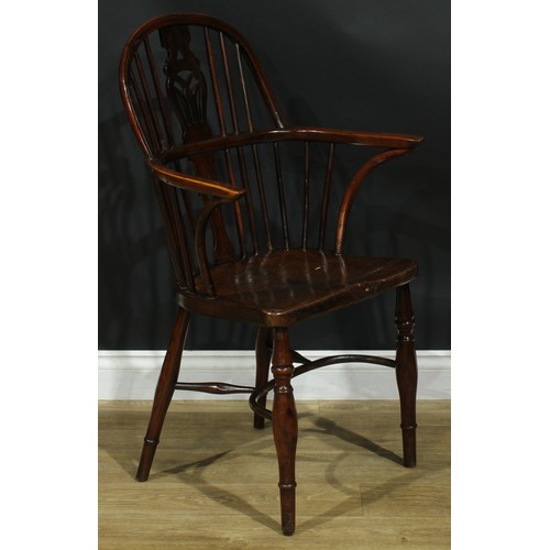 1122 - A set of four 19th century Windsor elbow chairs, each with a low hoop back, shaped and pierced splat... 