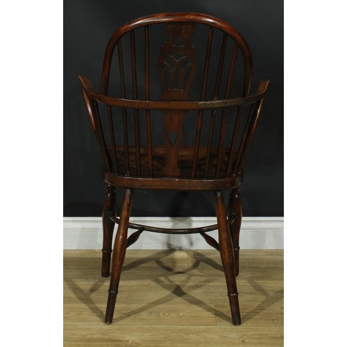 1122 - A set of four 19th century Windsor elbow chairs, each with a low hoop back, shaped and pierced splat... 