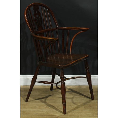 1122 - A set of four 19th century Windsor elbow chairs, each with a low hoop back, shaped and pierced splat... 