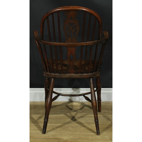 1122 - A set of four 19th century Windsor elbow chairs, each with a low hoop back, shaped and pierced splat... 