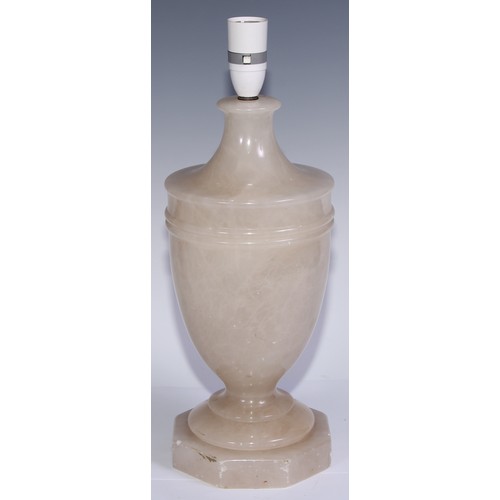 1016 - A garniture of three alabaster table lamps, the largest 33.5cm high under fitting (3)