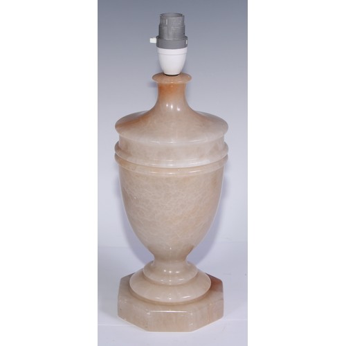 1016 - A garniture of three alabaster table lamps, the largest 33.5cm high under fitting (3)