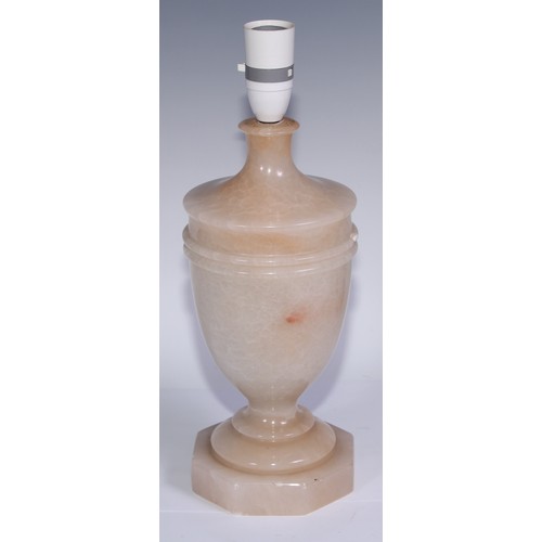 1016 - A garniture of three alabaster table lamps, the largest 33.5cm high under fitting (3)